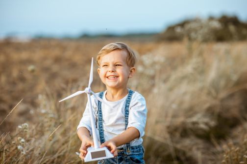 Child with toy wind turbine