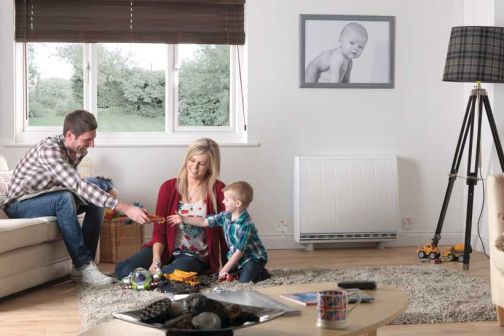 Dimplex quantum heater in living room beside mother, father and child