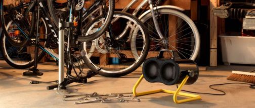 portable heater in home workshop with bikes in the background