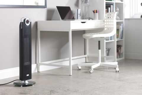Fan heater near study desk and chair