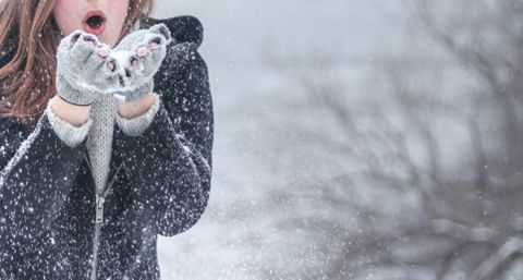 lady blowing snow 