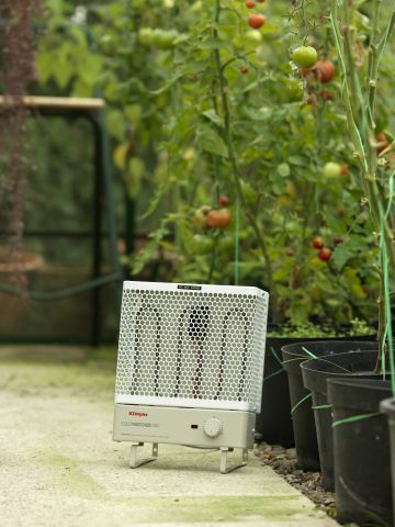MPH portable heater in a garden next to plants