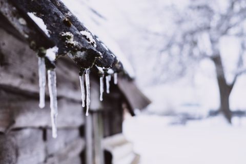 icicles hanging on snow covered roof