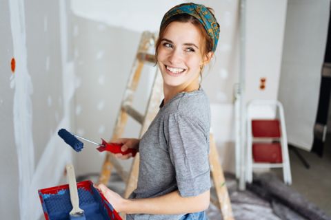 woman painting wall