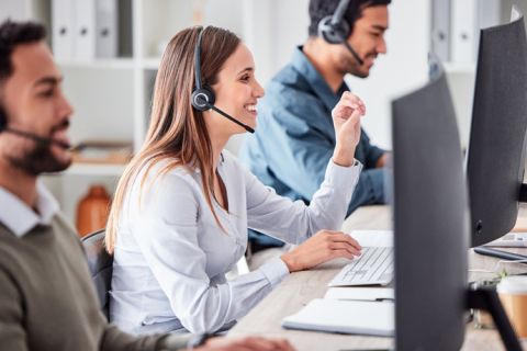 happy team talking on headsets