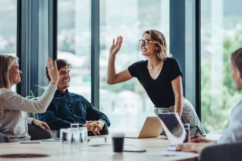 professional team giving each a hi-five