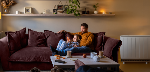 Father and child reading on the sofa